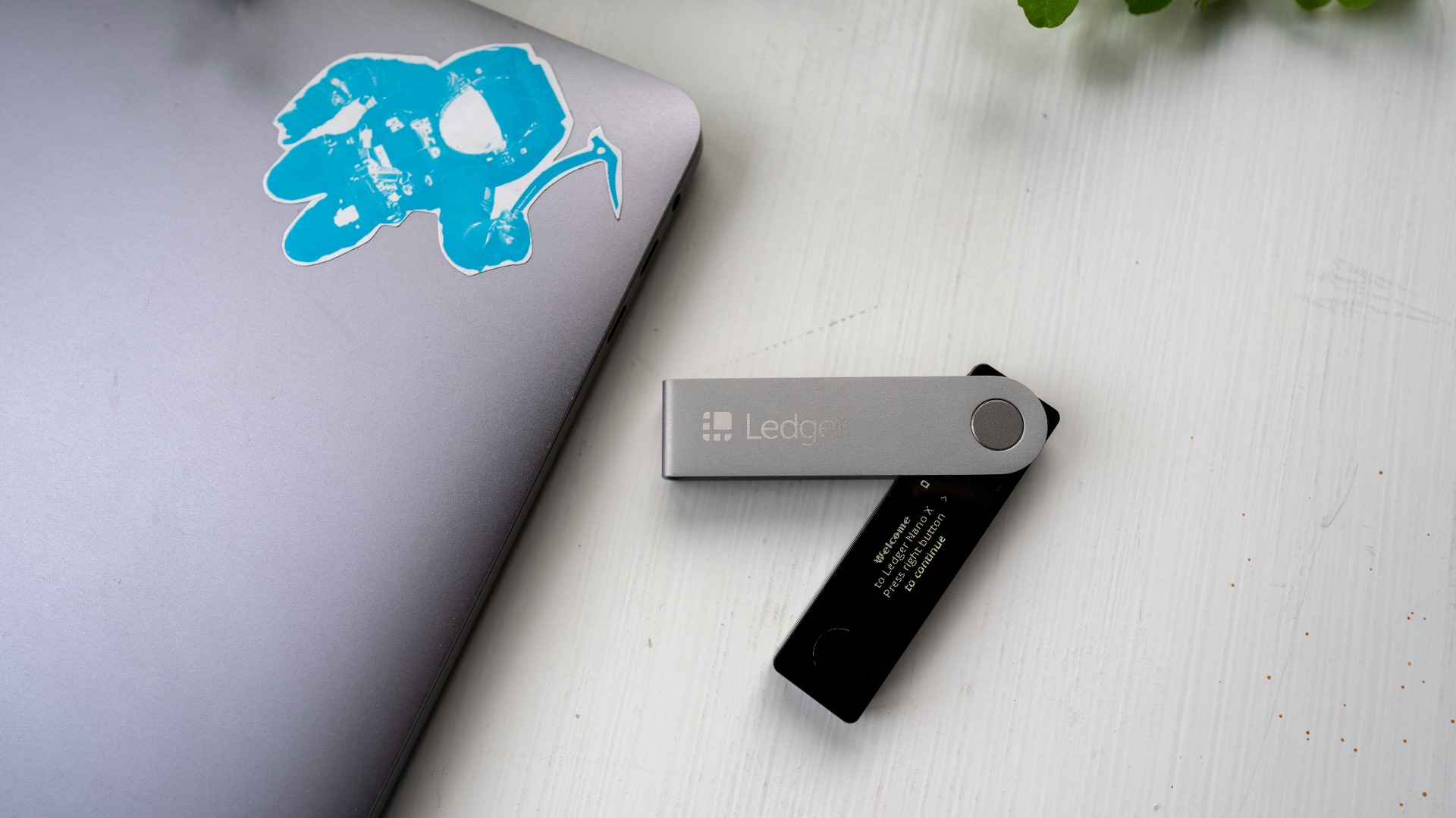 a laptop computer sitting on top of a white table
