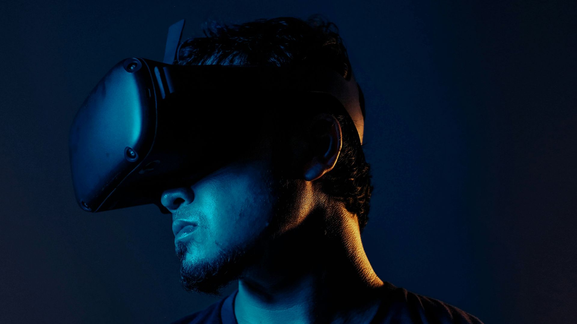 man in black crew neck shirt wearing black headphones