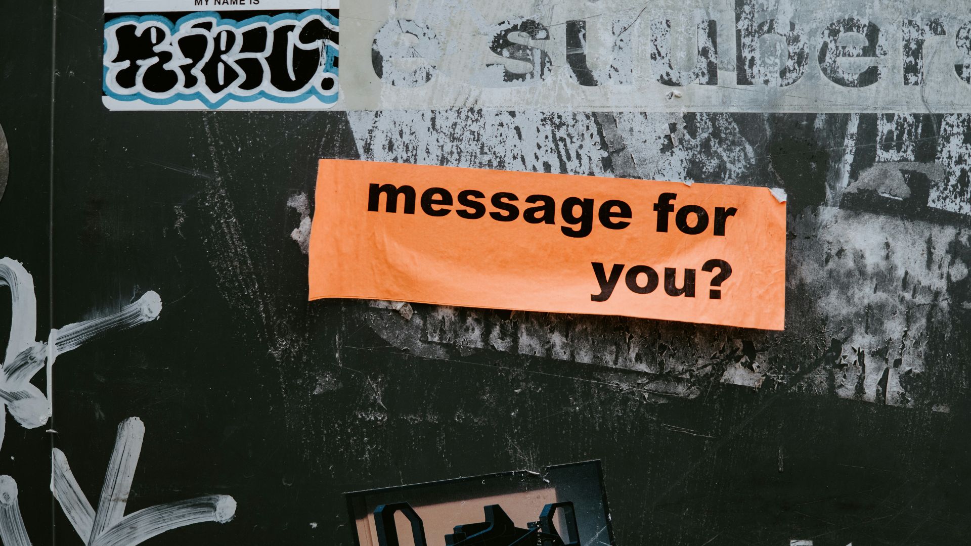 a sign on a wall that says message for you?