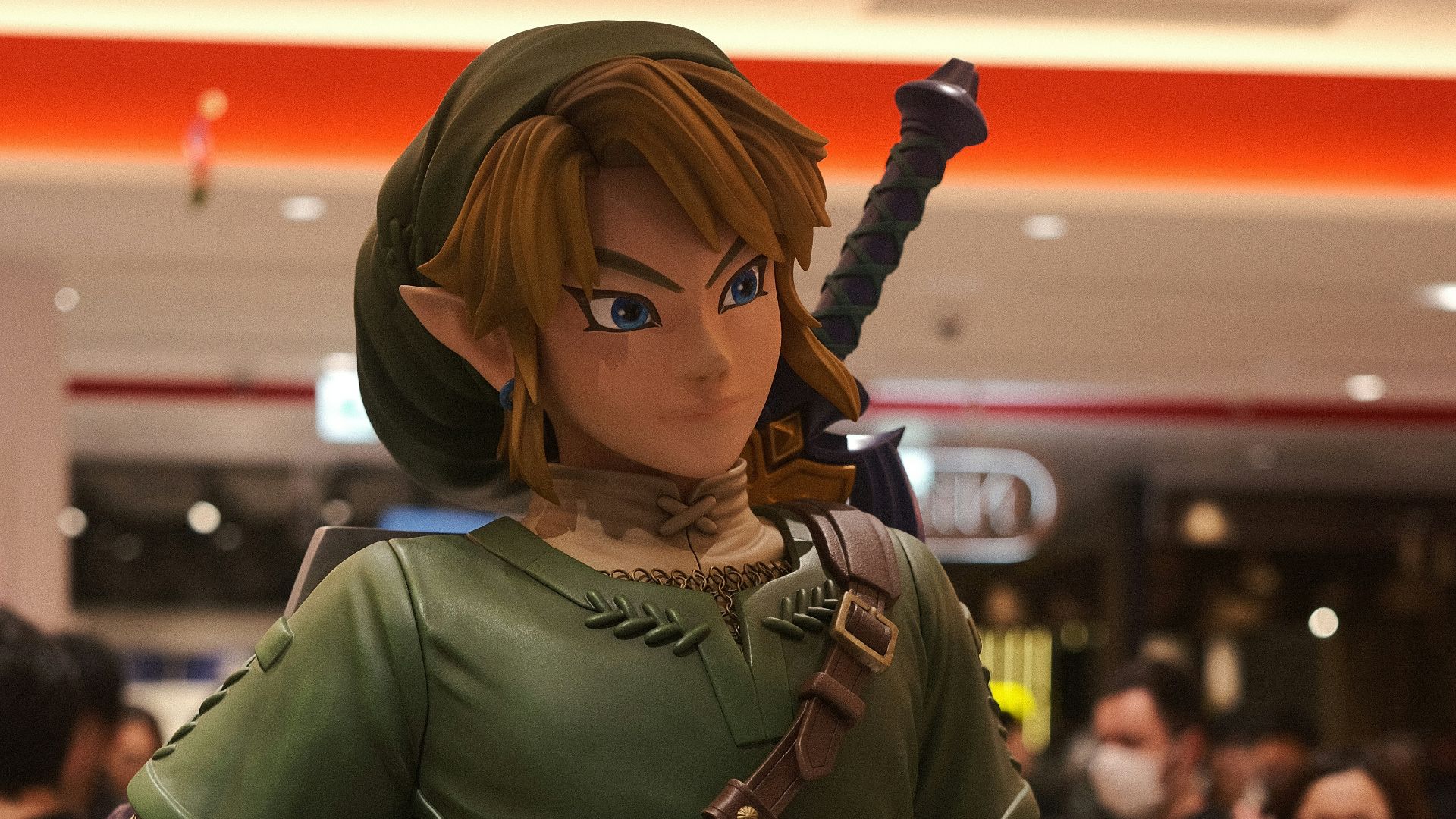 a statue of a woman in a green outfit