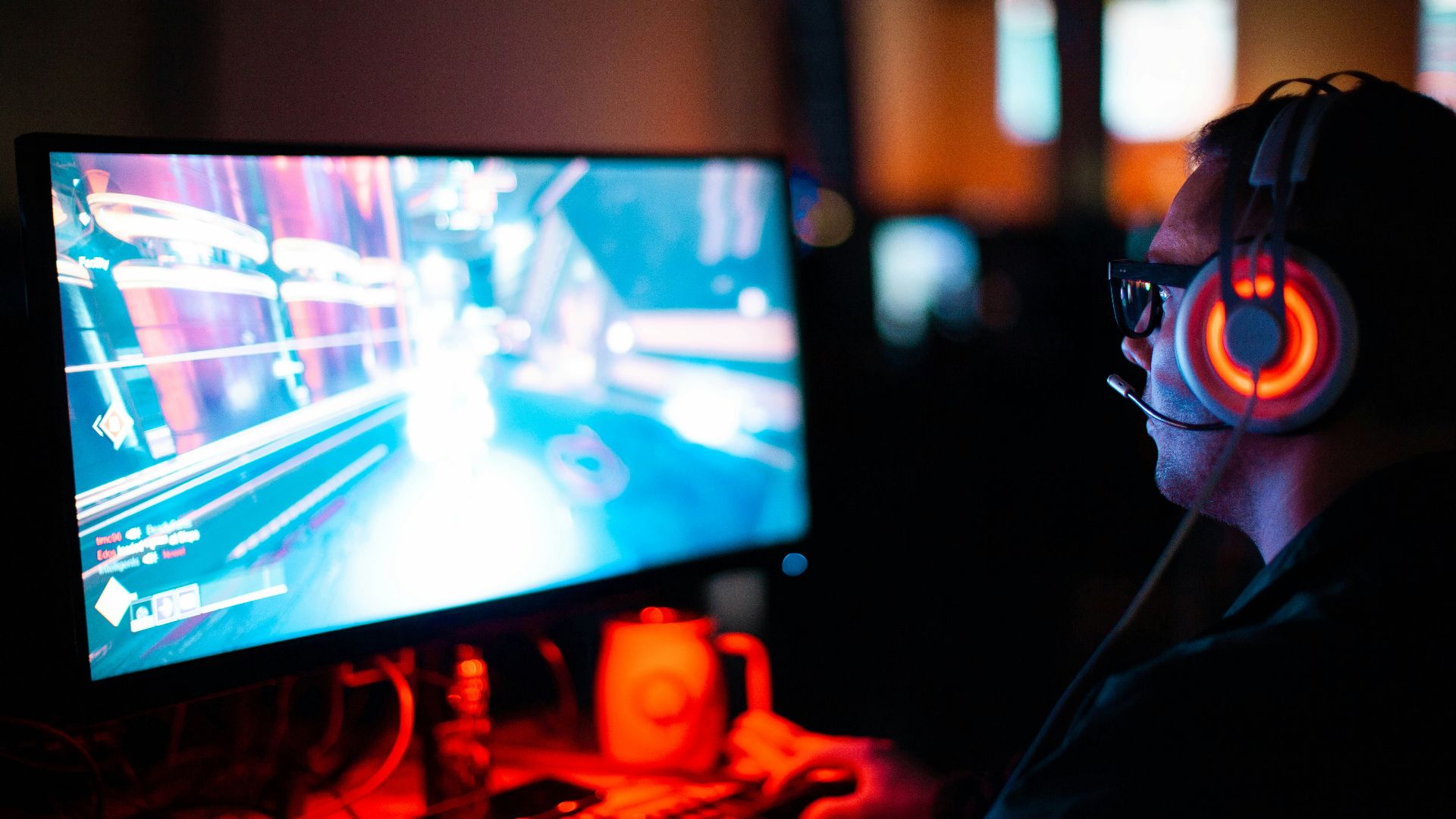 person using computer playing FPS game