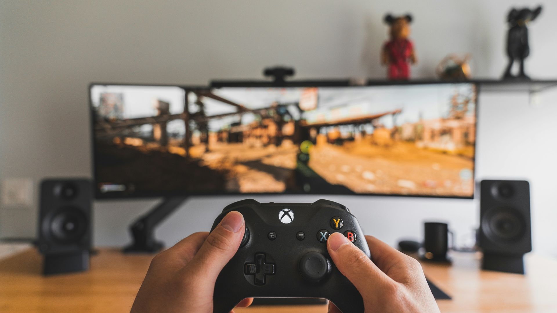 person holding black game controller