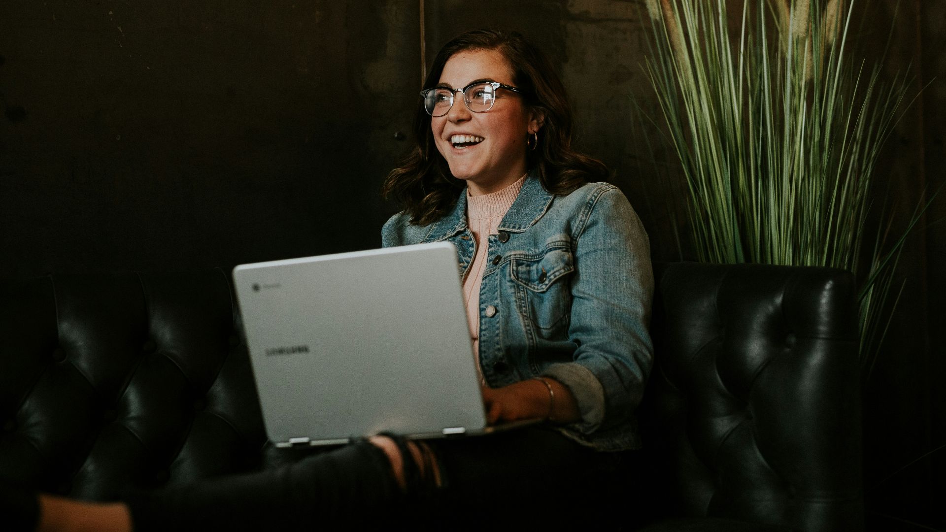 silver laptop on woman's lap