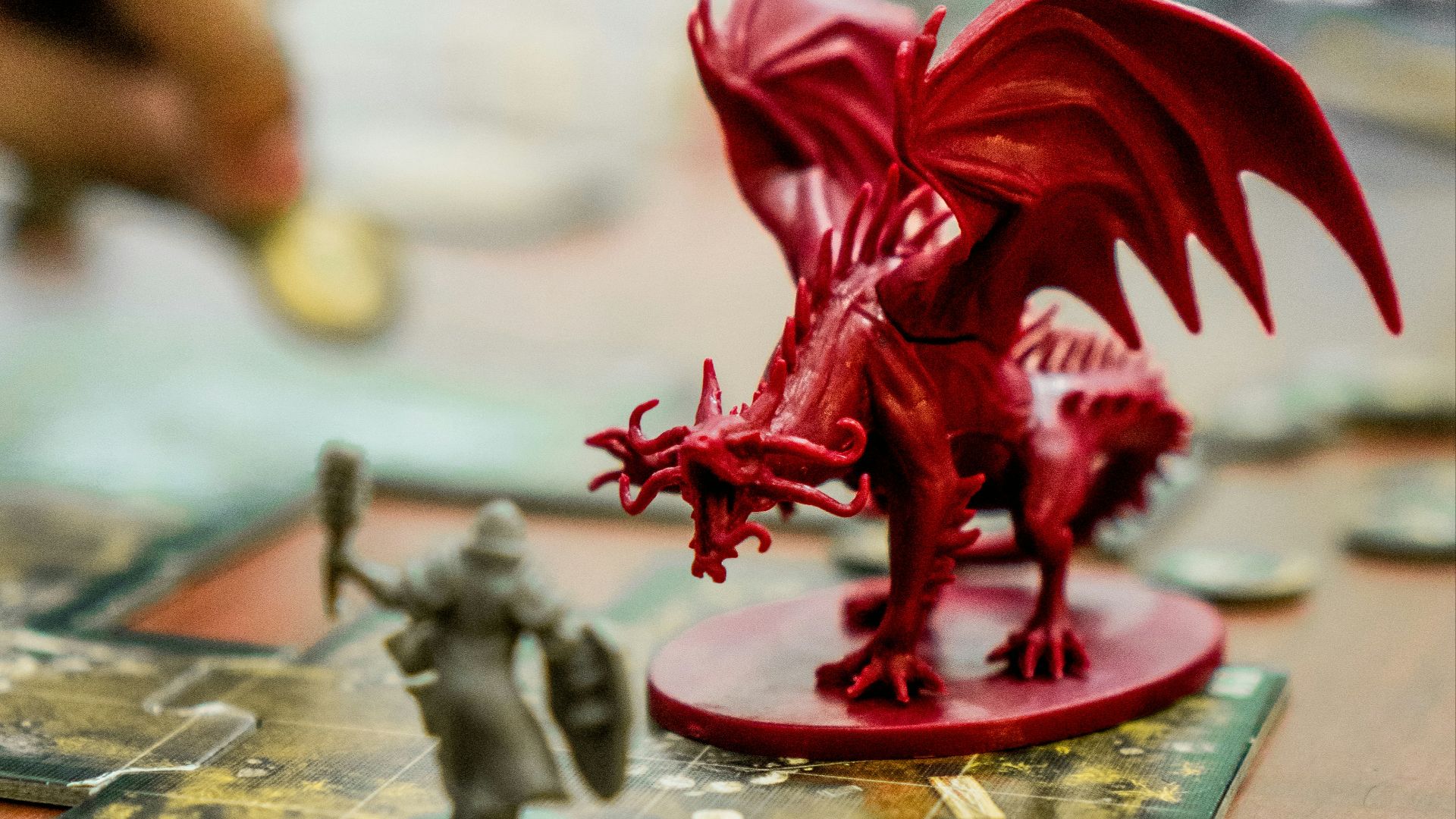 red dragon action figure on table
