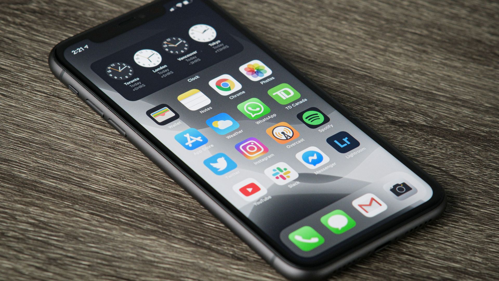 black iphone 5 on brown wooden table