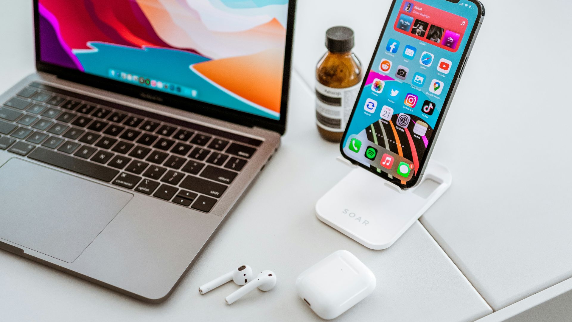 a laptop computer sitting on top of a white table
