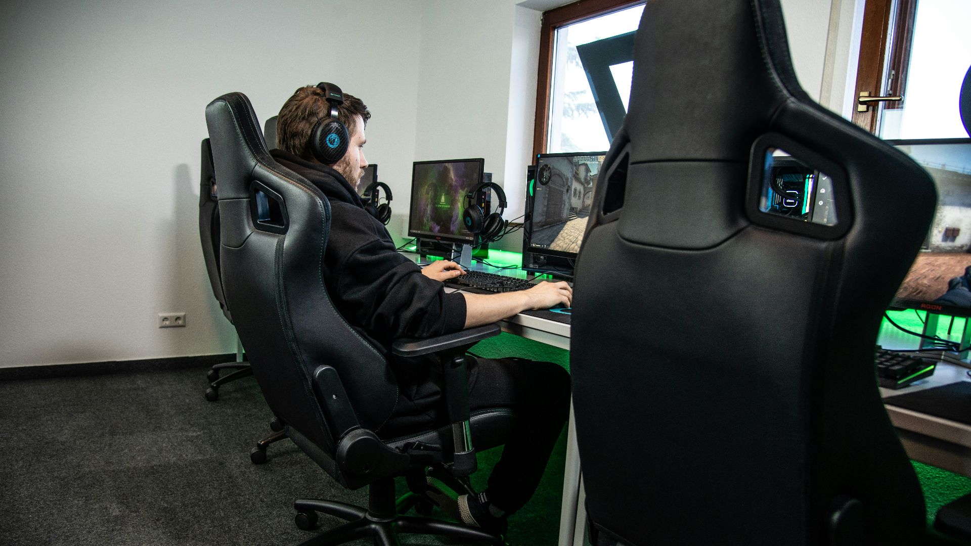 woman in black jacket sitting on black office rolling chair