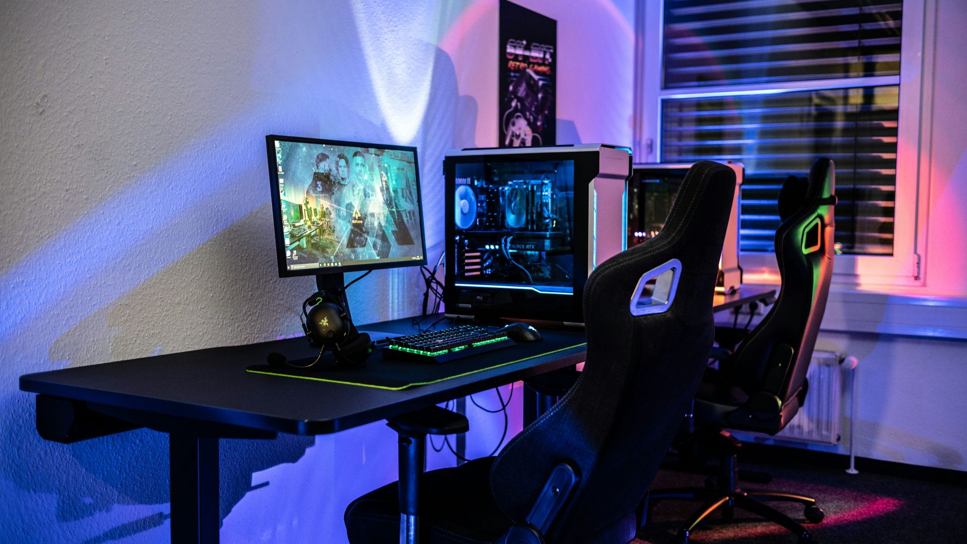 a computer desk with two monitors and a keyboard