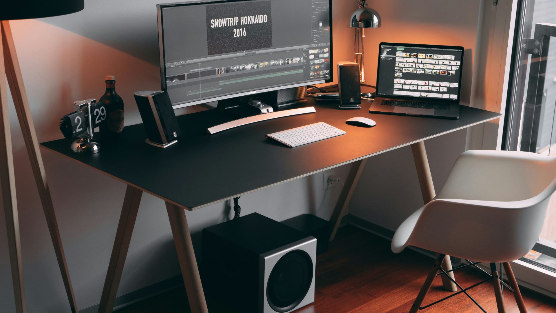 black flat screen computer monitor on black wooden table