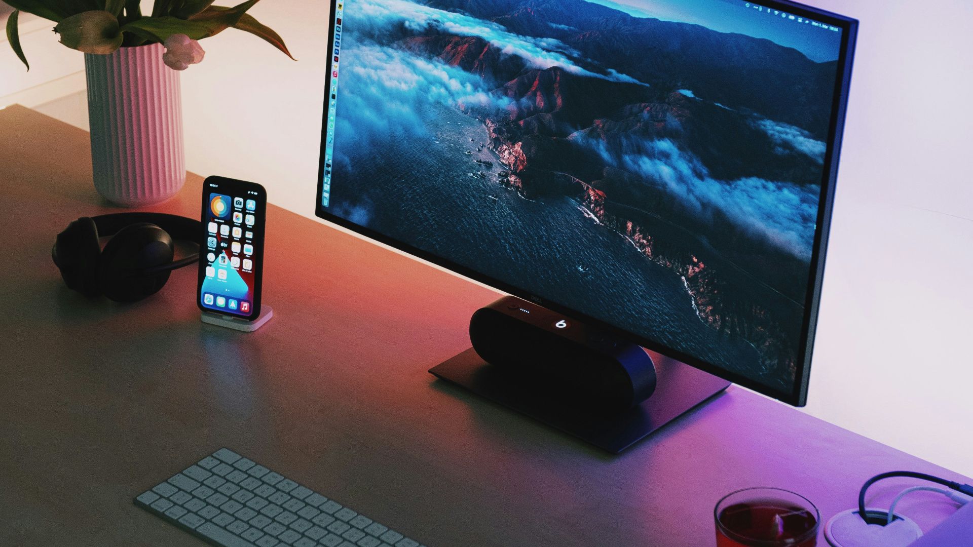 black flat screen computer monitor beside black and gray remote control