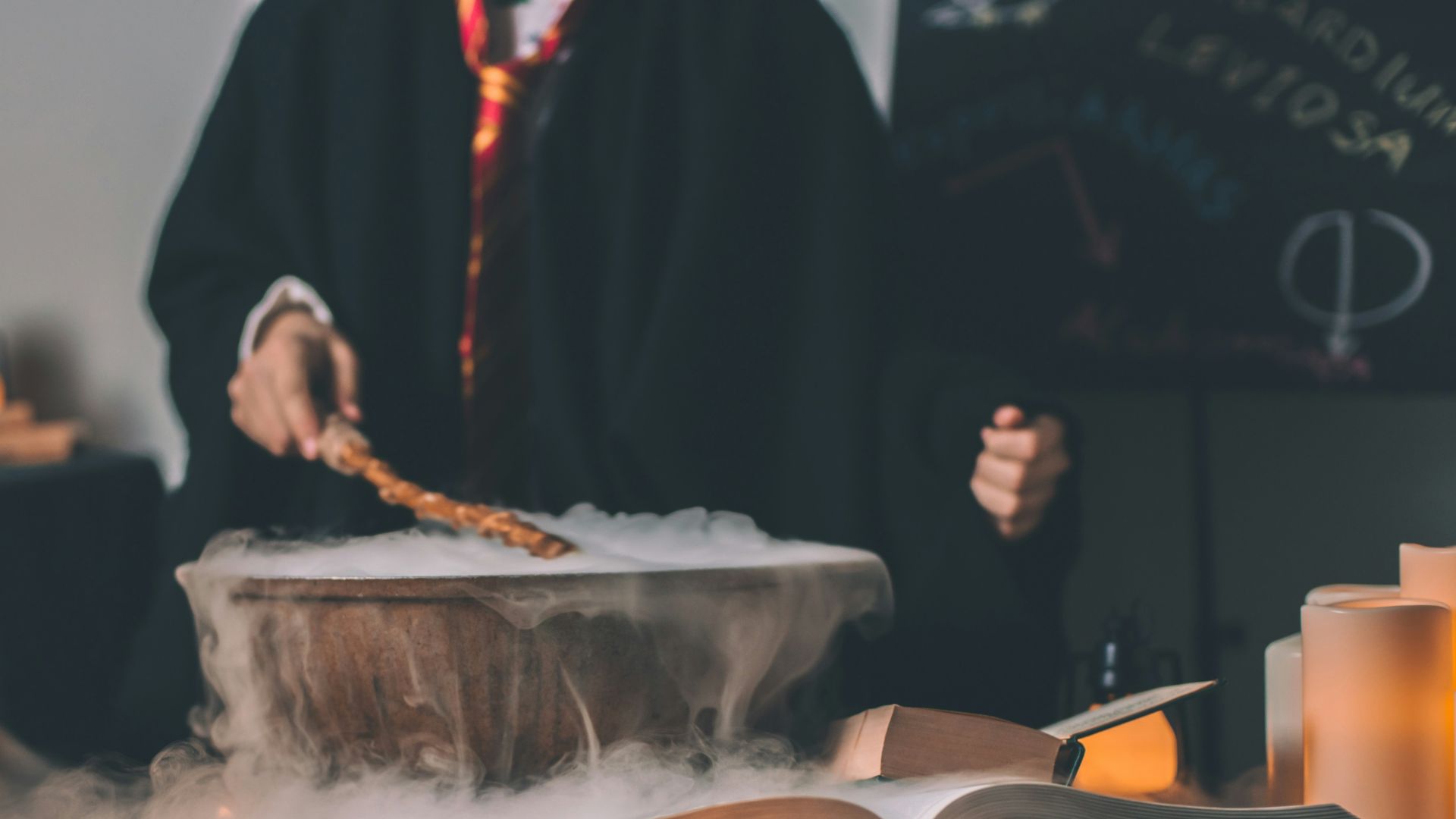 person holding wand on top of bowl