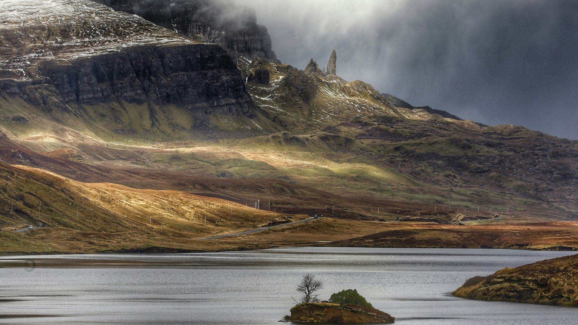 aerial photo of mountain and body of water at daytime