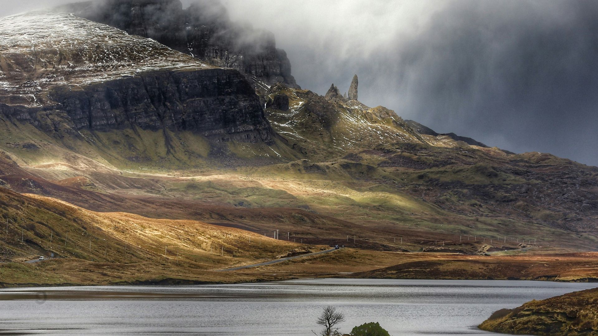aerial photo of mountain and body of water at daytime