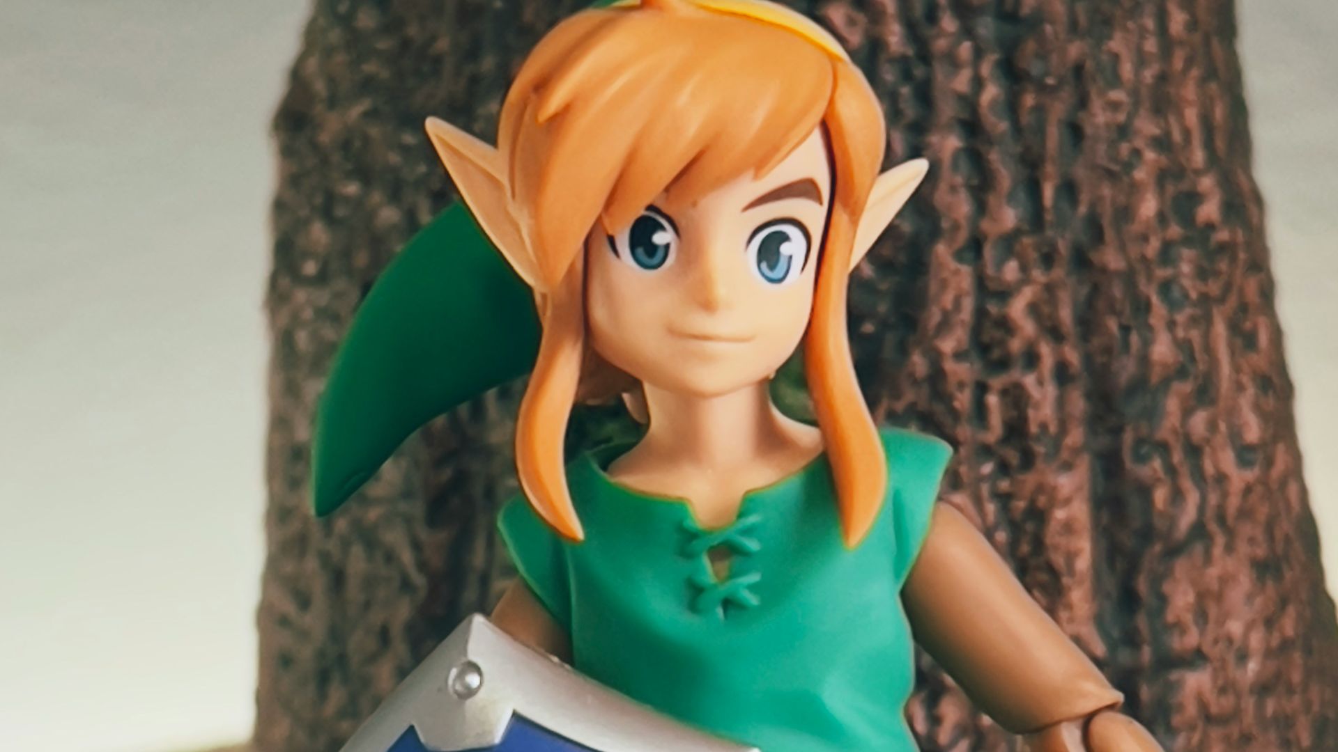 a toy girl holding a sign