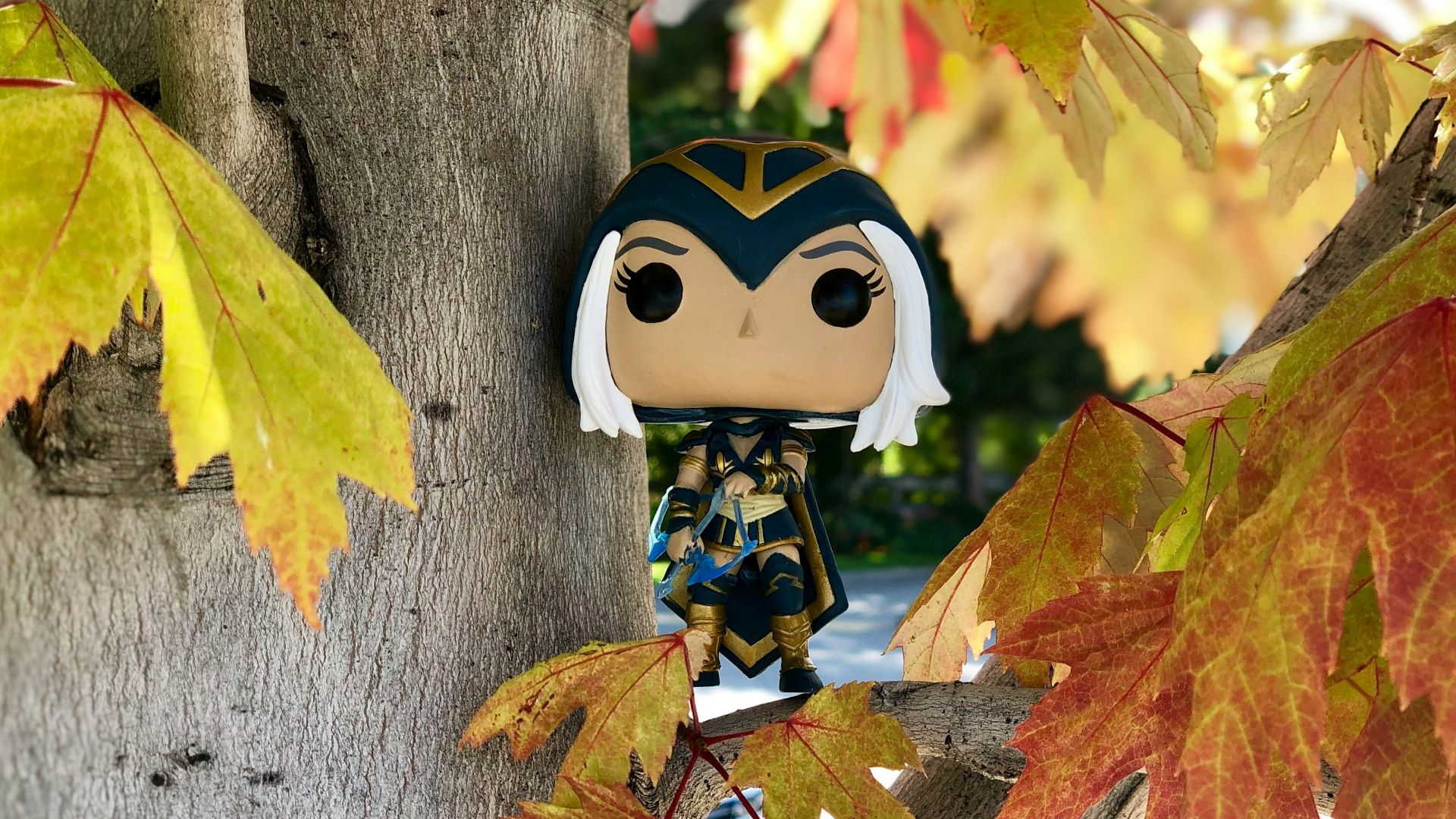 white and black panda head ornament on brown tree trunk