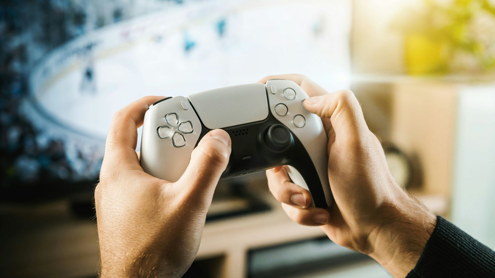 person holding black game controller