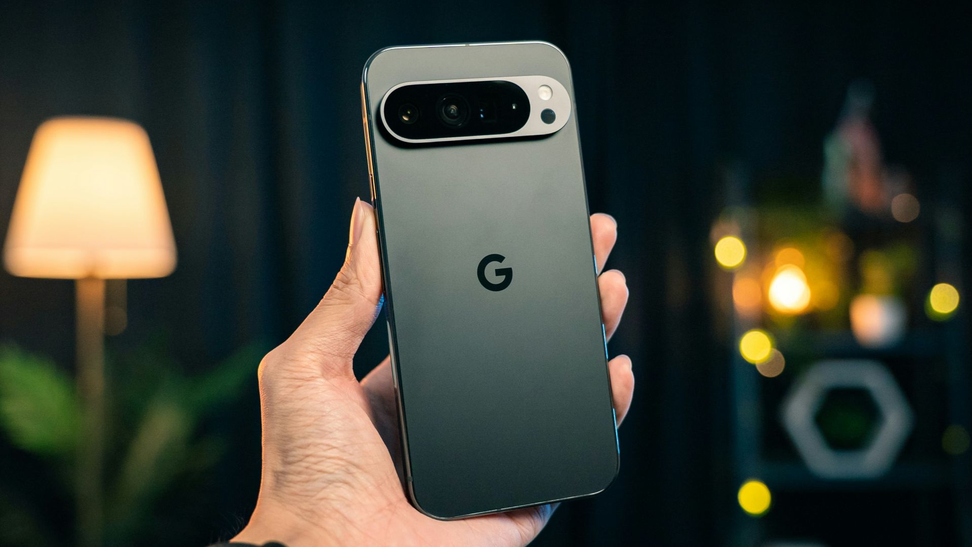 A person holding a cell phone in their hand