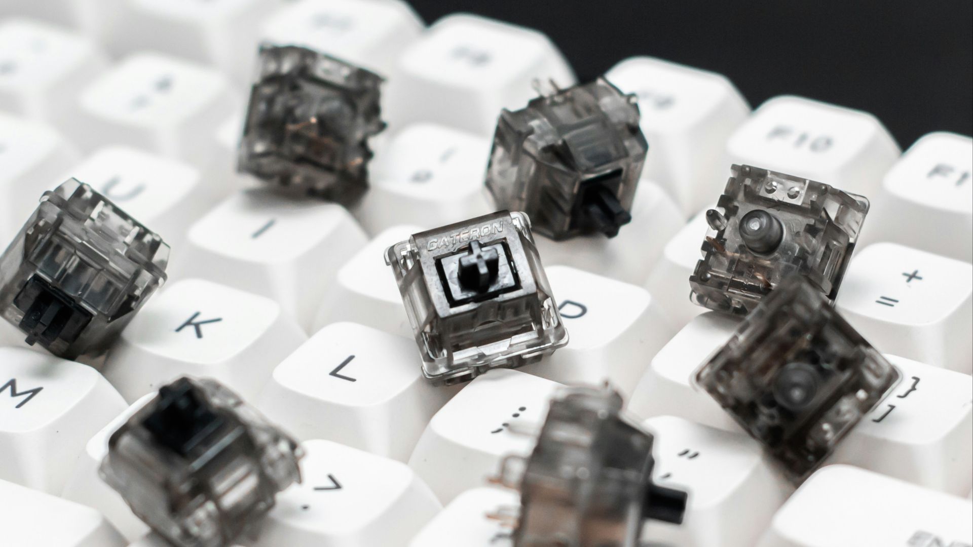 a close up of a keyboard with a bunch of small objects on it