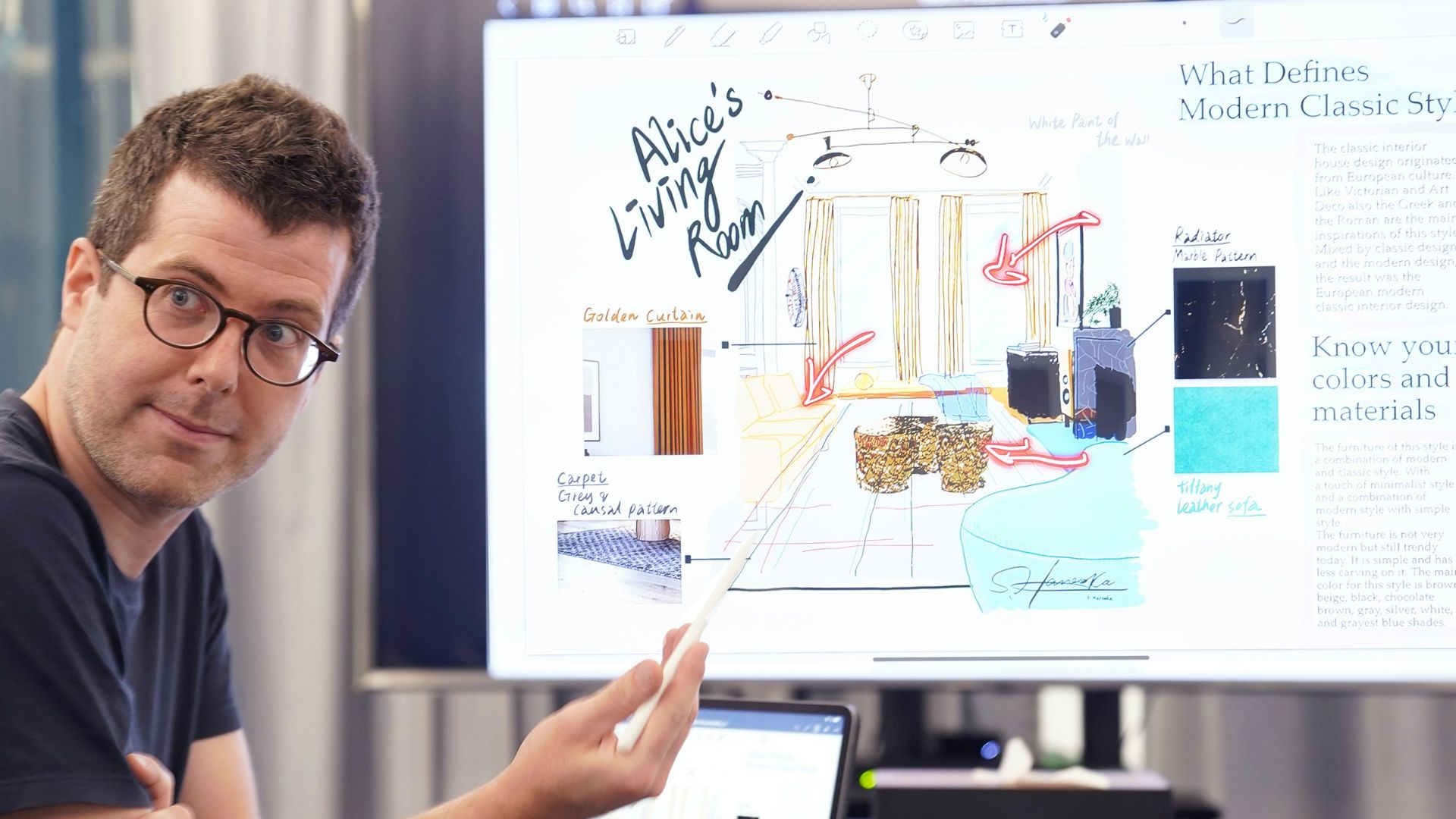 a man sitting at a desk with a laptop and a white board