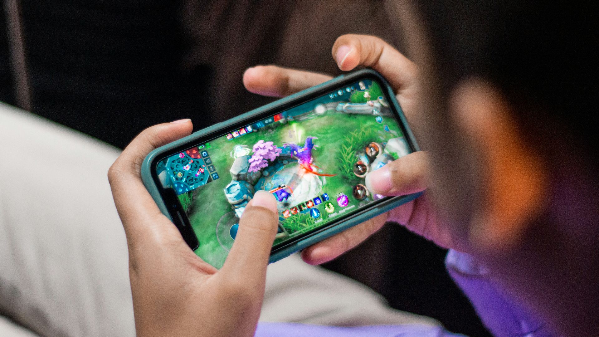 a person is playing a video game on their phone