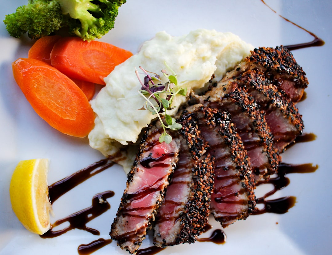 cooked food with sliced carrots and green vegetable