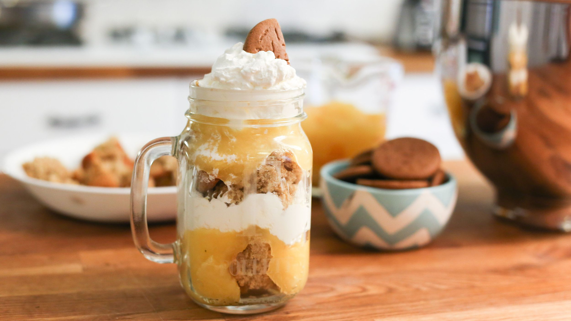 File:Pumpkin pudding trifle in a mason jar next to cookies on a table (15628352130).jpg