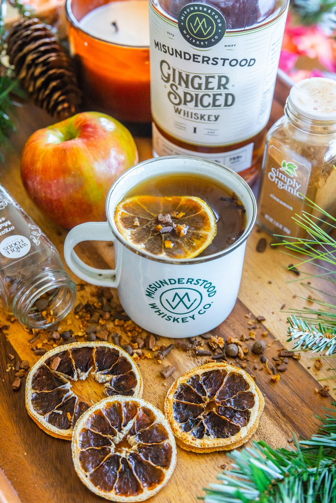 a cup of tea and some sliced oranges on a table
