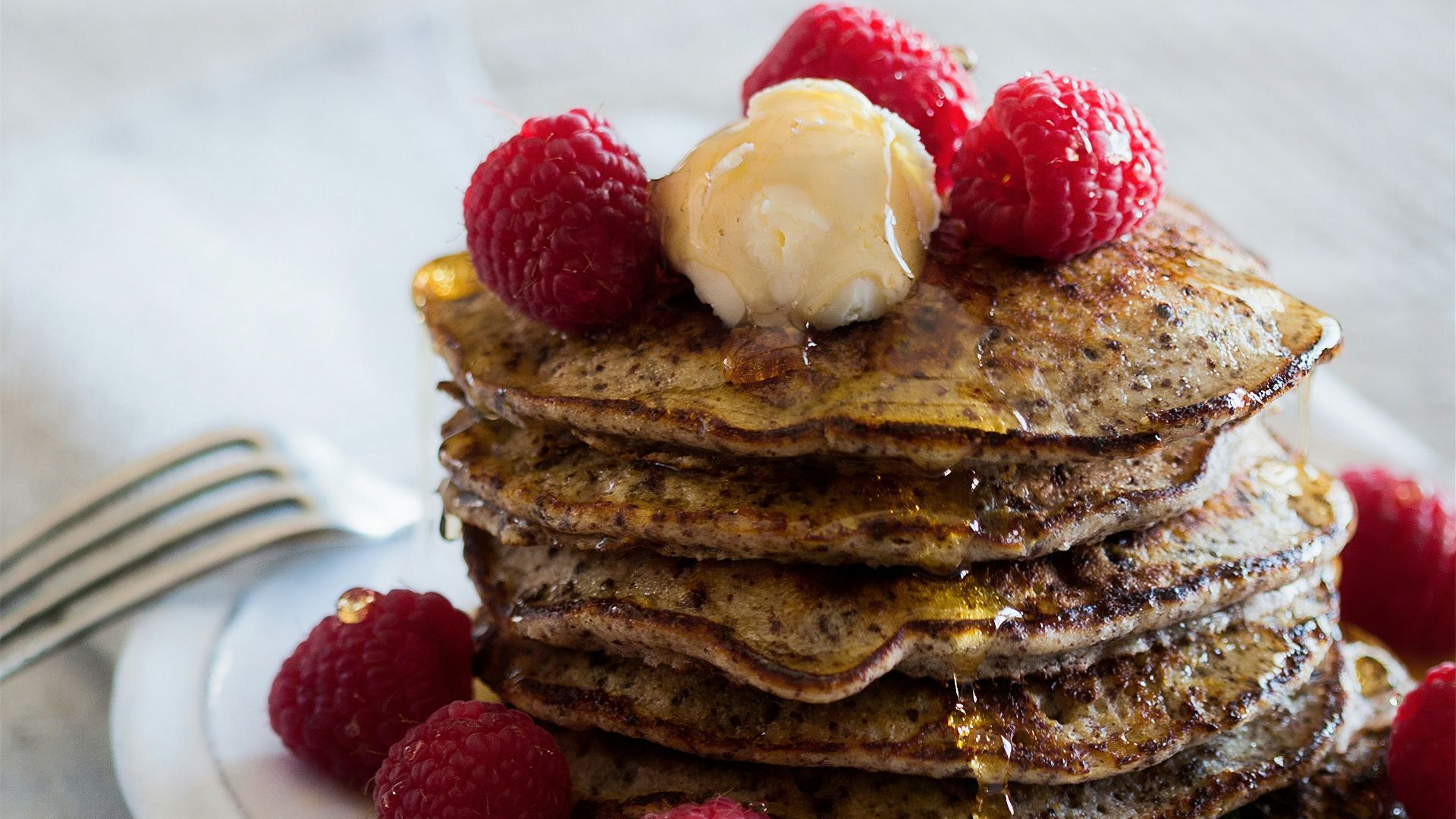 chocolate cake with white icing on white ceramic plate