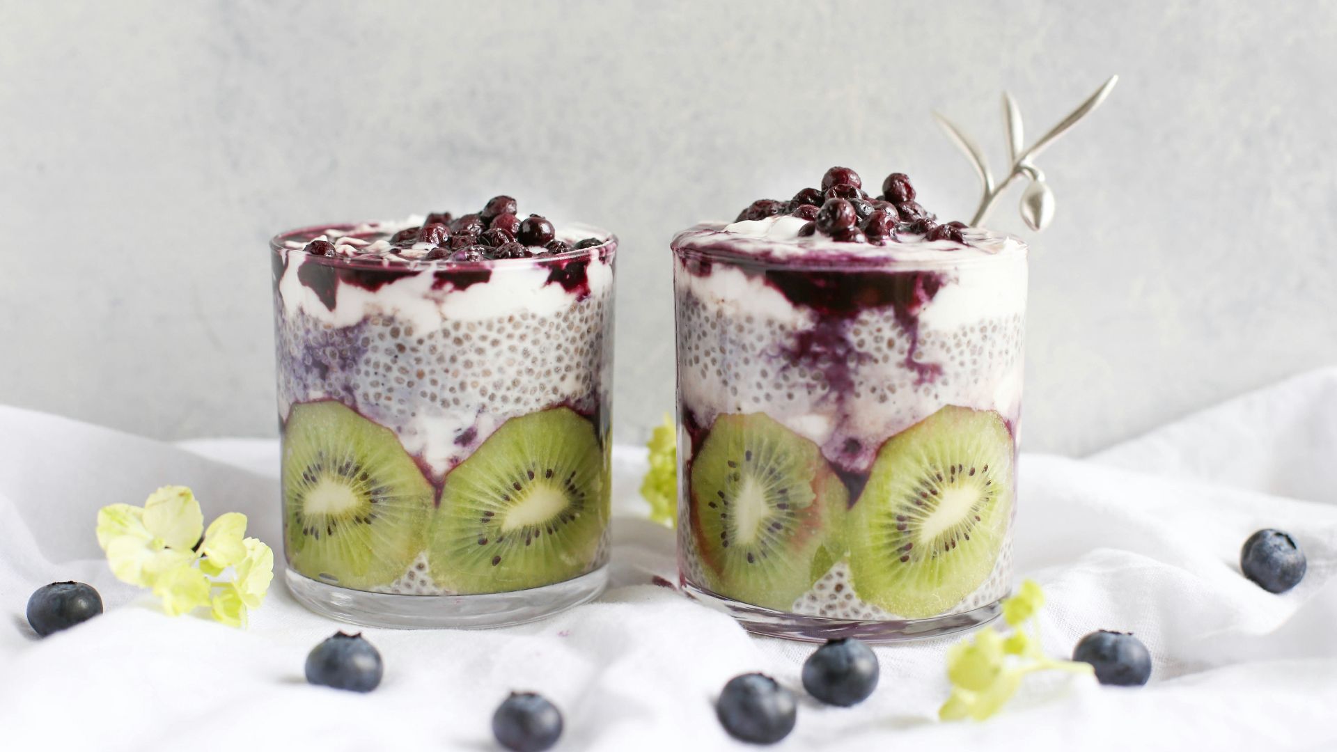 two fruit beverages on glass cups
