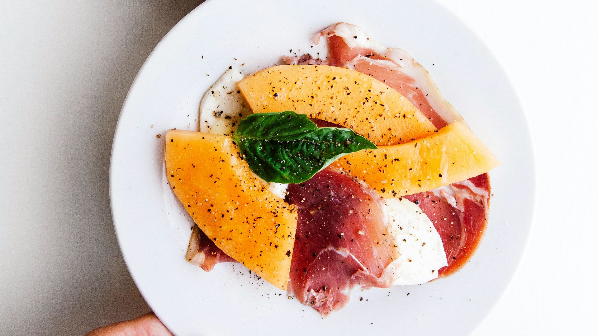 two raw meats on white ceramic plates