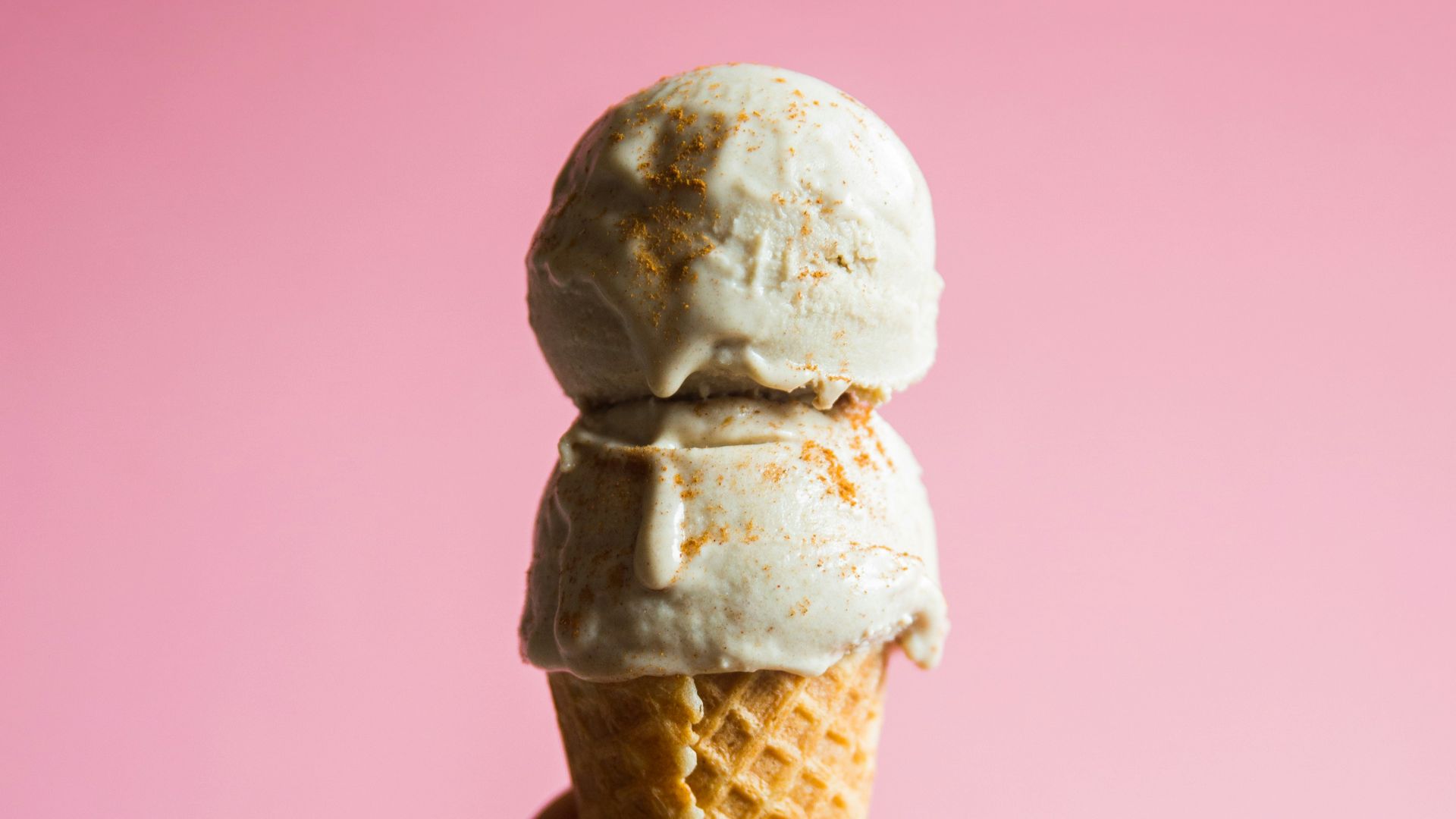 person holding ice cream on cone