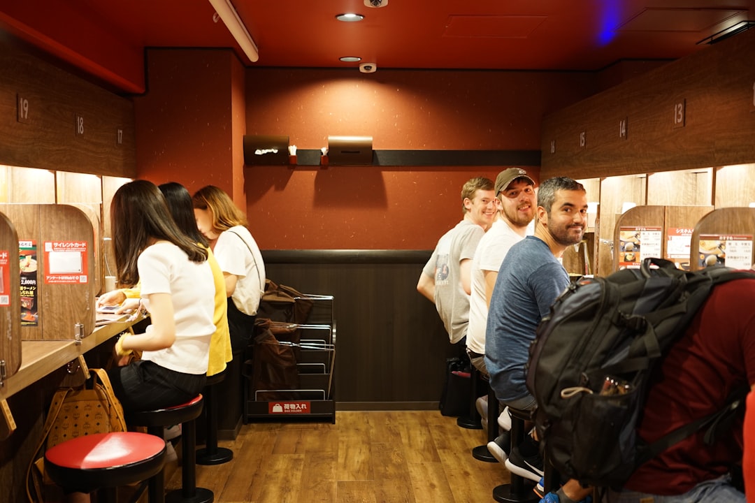 A group of people standing in a room