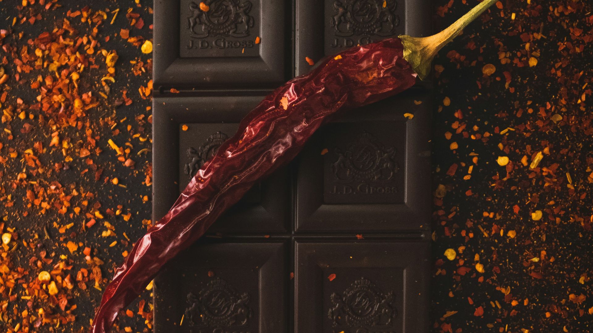 red and brown dried leaf on black wooden door