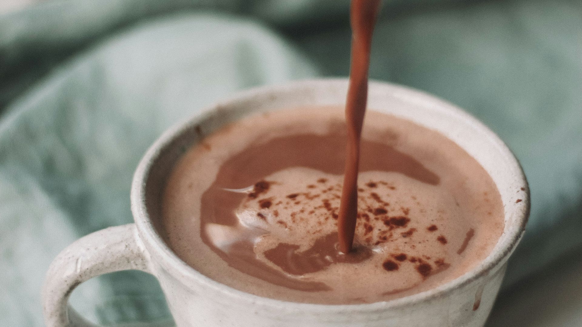 chocolate coffee pouring in white mug