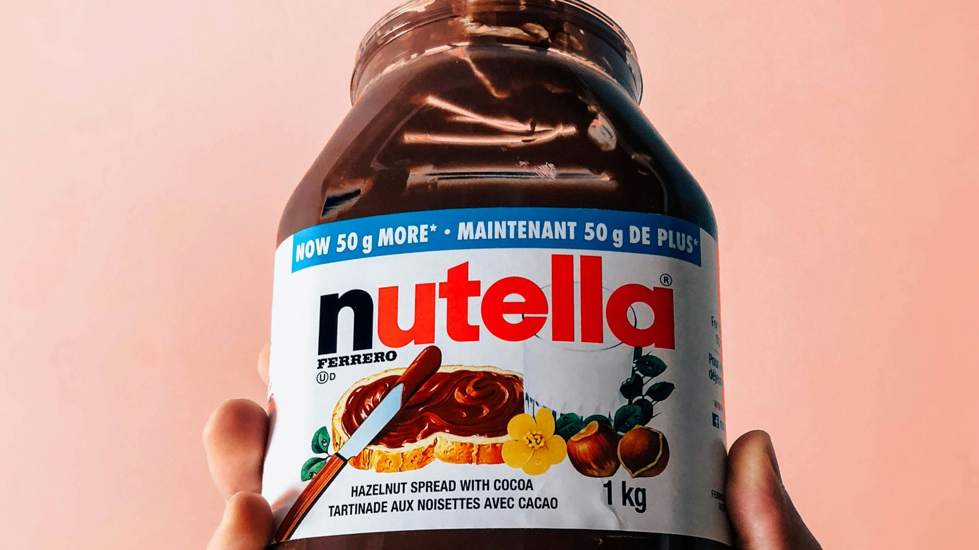 person holding Nutella jar