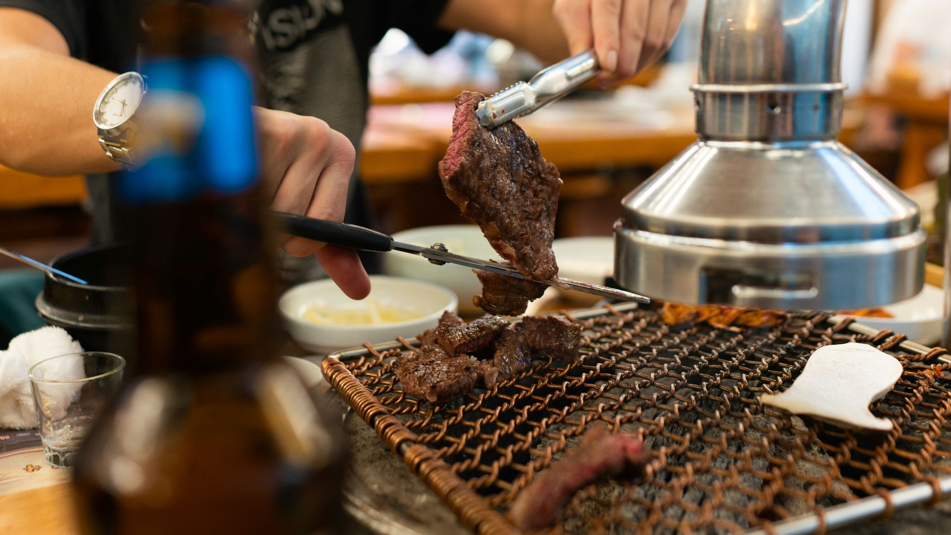 person holding stainless steel kettle