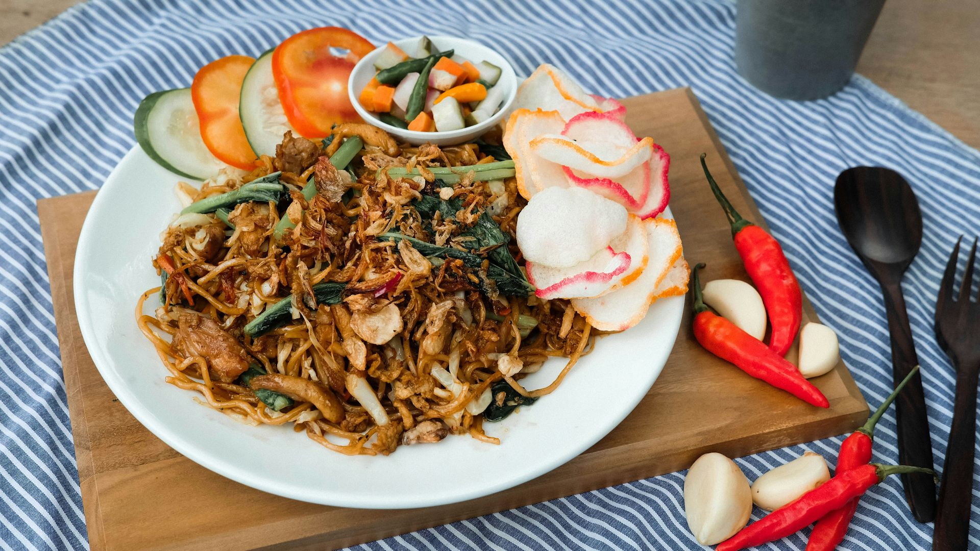 a plate of food on a table with utensils
