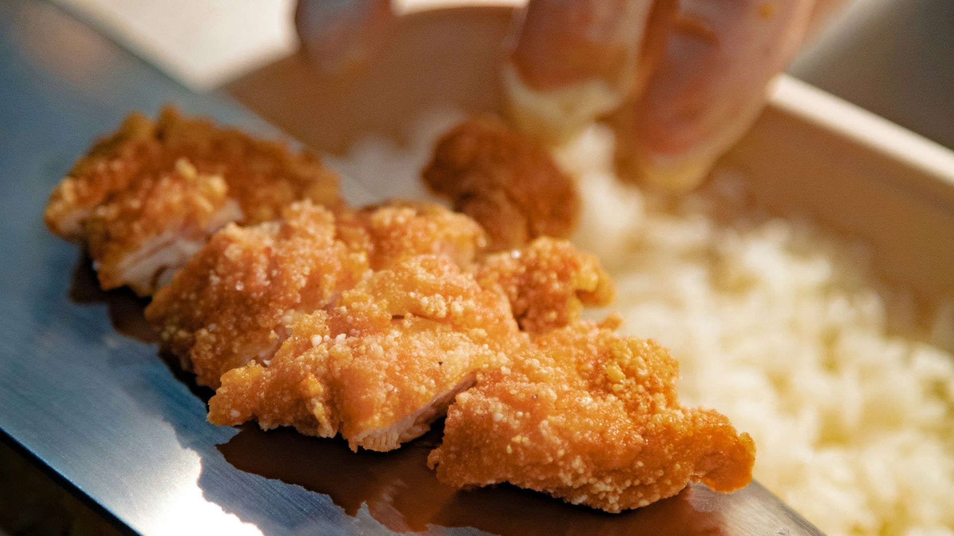 person holding brown cookies on blue ceramic plate