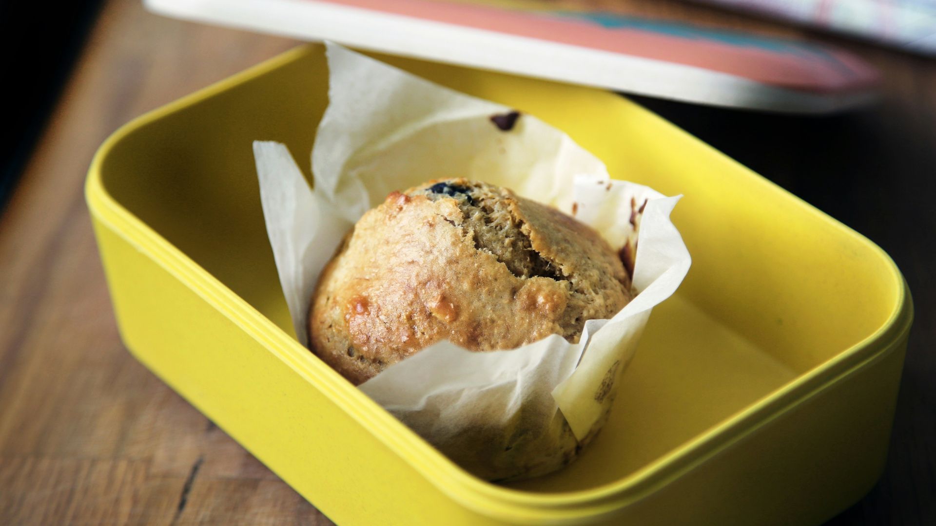 muffin on yellow plastic container