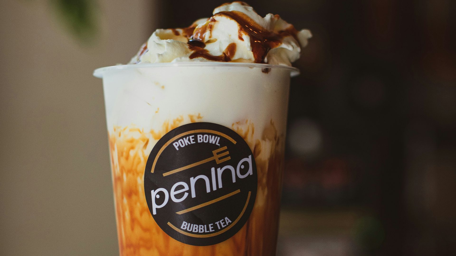 a cup of coffee with whipped cream and caramel