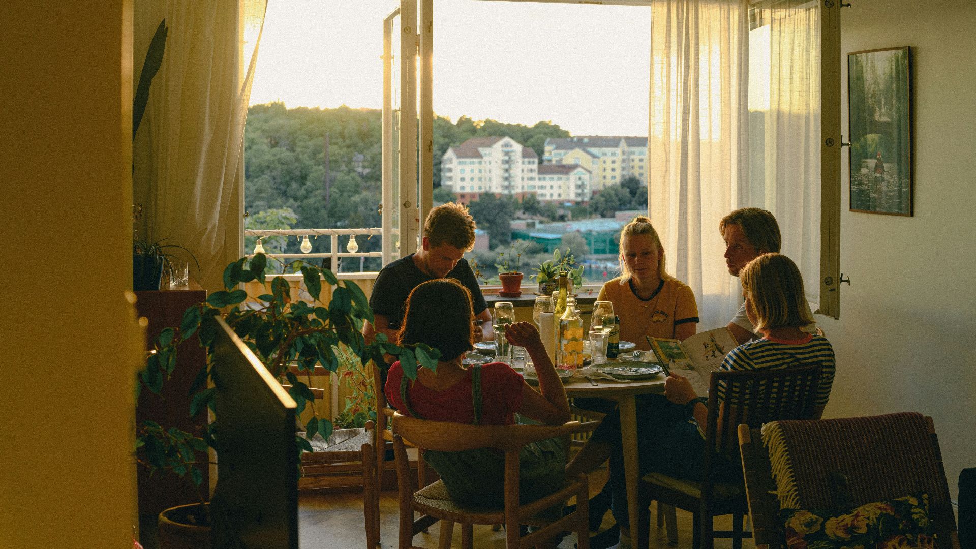 a group of people sitting around a table