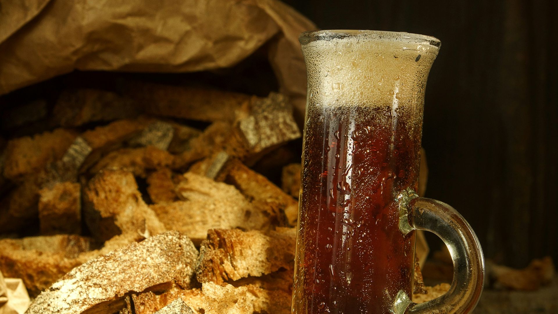 clear glass mug with brown liquid inside