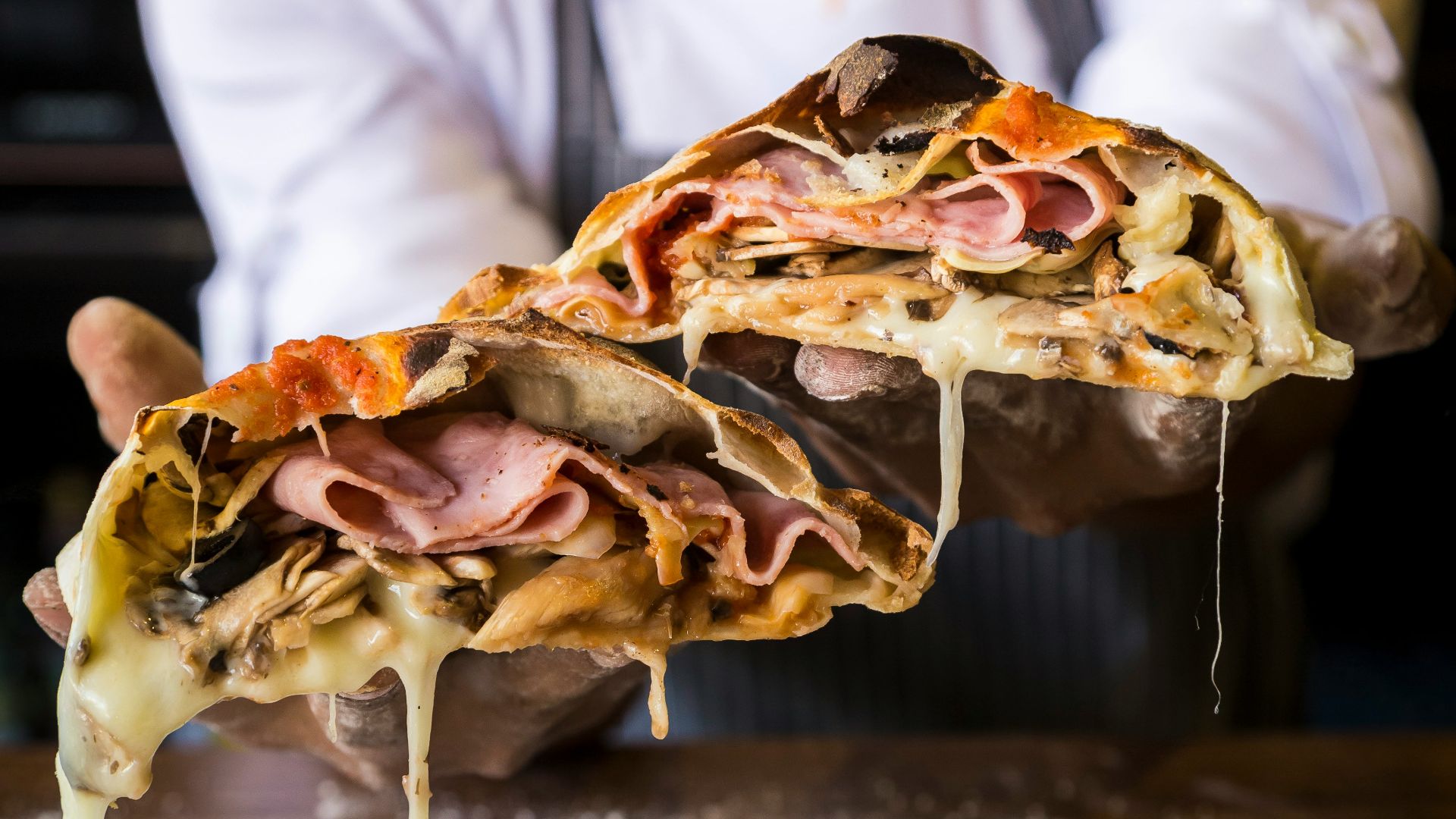 woman holding pizza