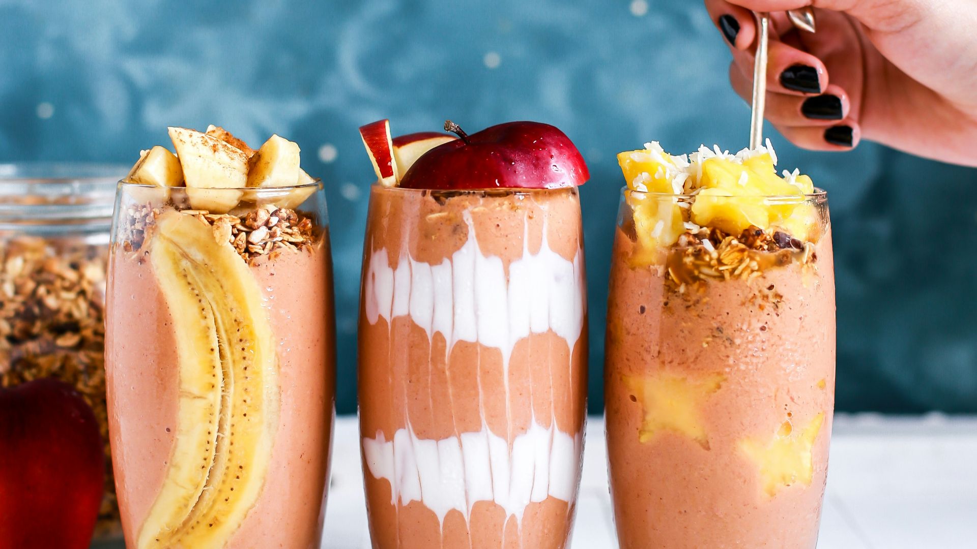 three clear drinking glass filled by shakes