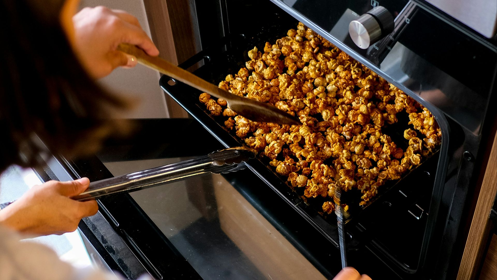 person holding brown wooden stick