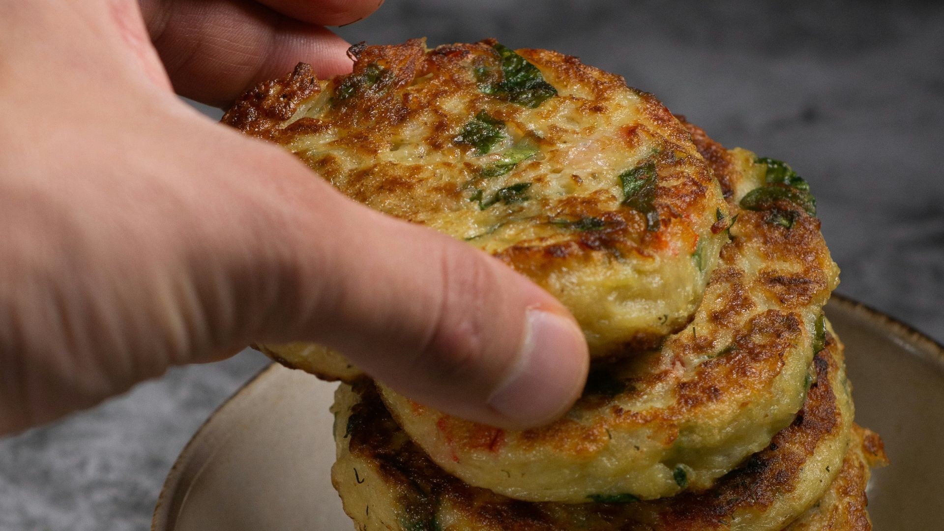 person holding a plate with bread