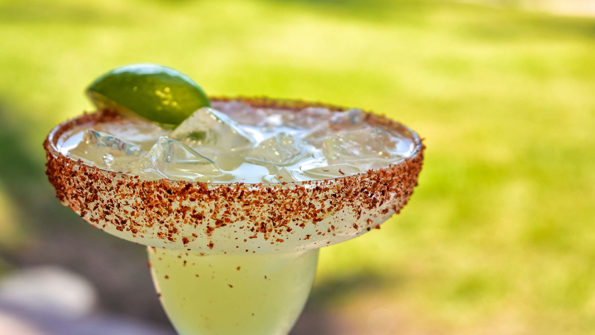 a close up of a drink in a glass on a table