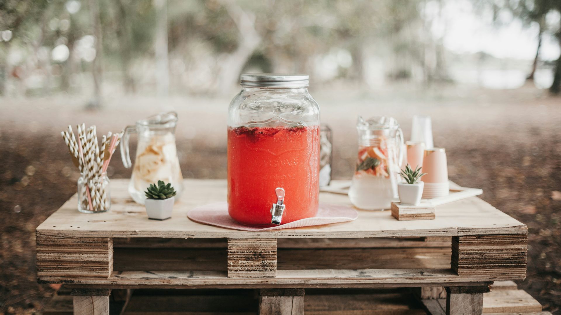 red juice in clear glass jar
