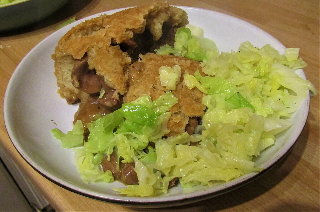 -2020-11-18 Dish Of Homemade Steak And Kidney Pudding With Cabbage, Trimingham