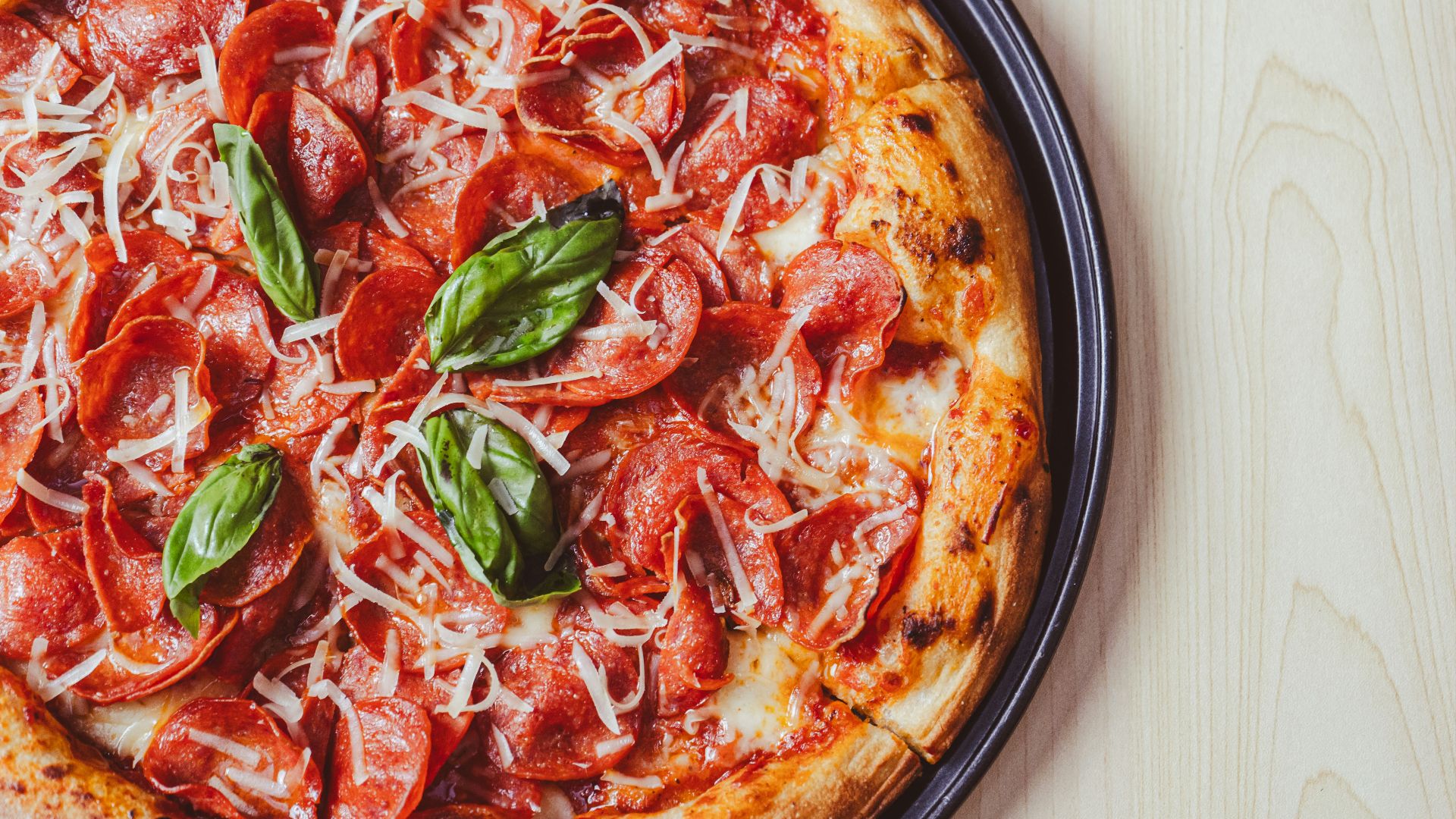 a close up of a pizza on a plate on a table